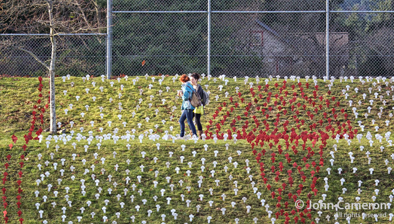 students walk through AIDS crosses at GISS